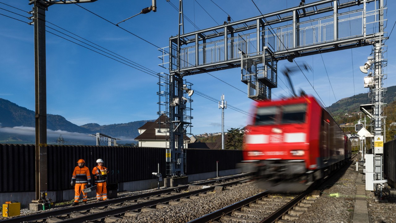A locomotive passing an out-of-profile and antenna detection system.